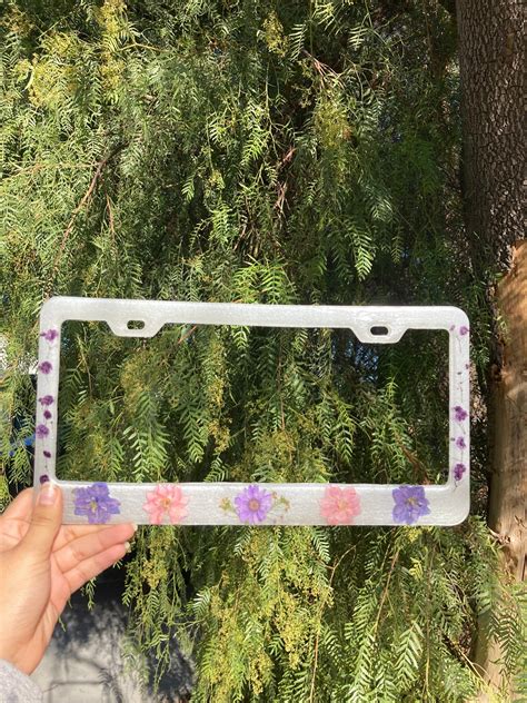 Flower license plate frame - Check out our blue flower license plate frame selection for the very best in unique or custom, handmade pieces from our shops. 